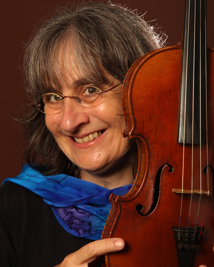 Andrea Hoag in blue scarf with fiddle